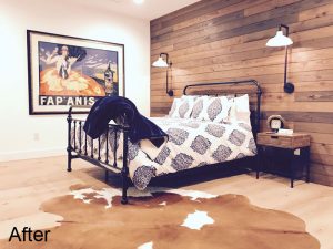 bedroom with wood wall feature