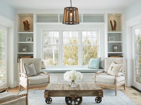 Lake cottage sitting room with pale blue and open shelves