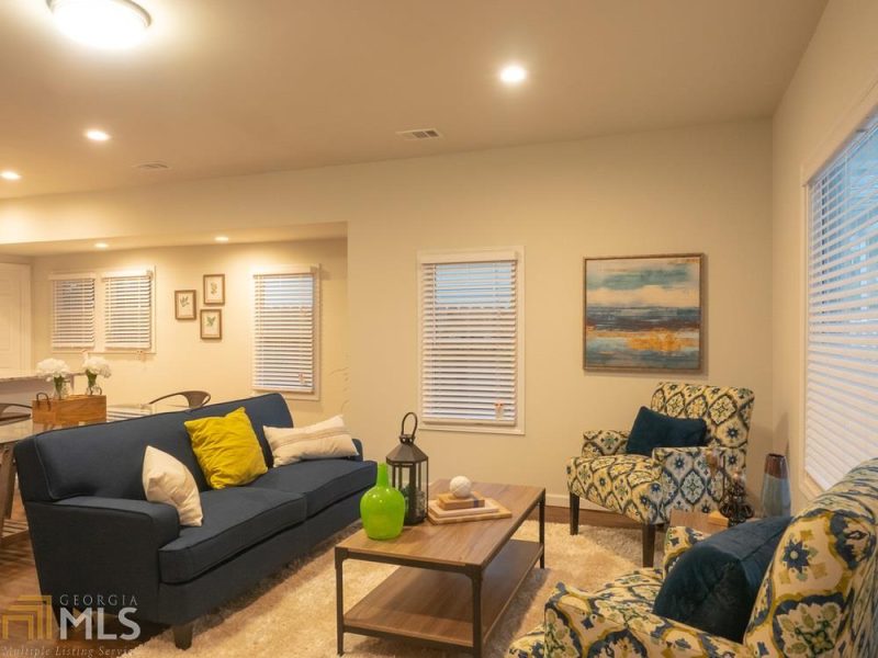 Modern cottage living with colorful furniture.