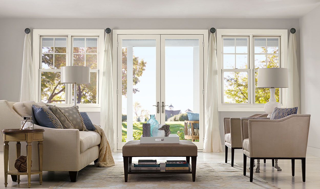 french doors in a pretty cottage living room