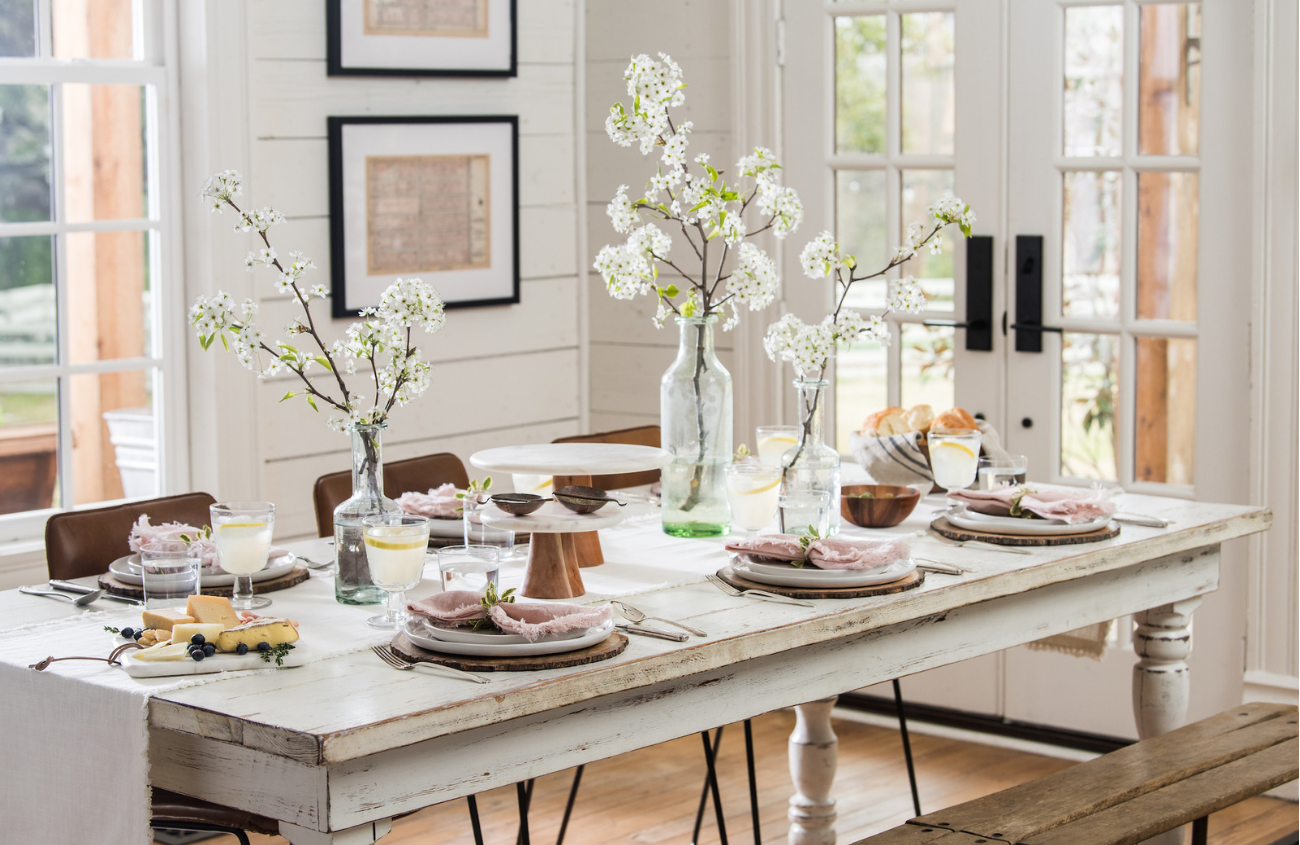 Jo's fresh tables cape for spring 2019 featuring light and bright table settings with white rustic dining table.