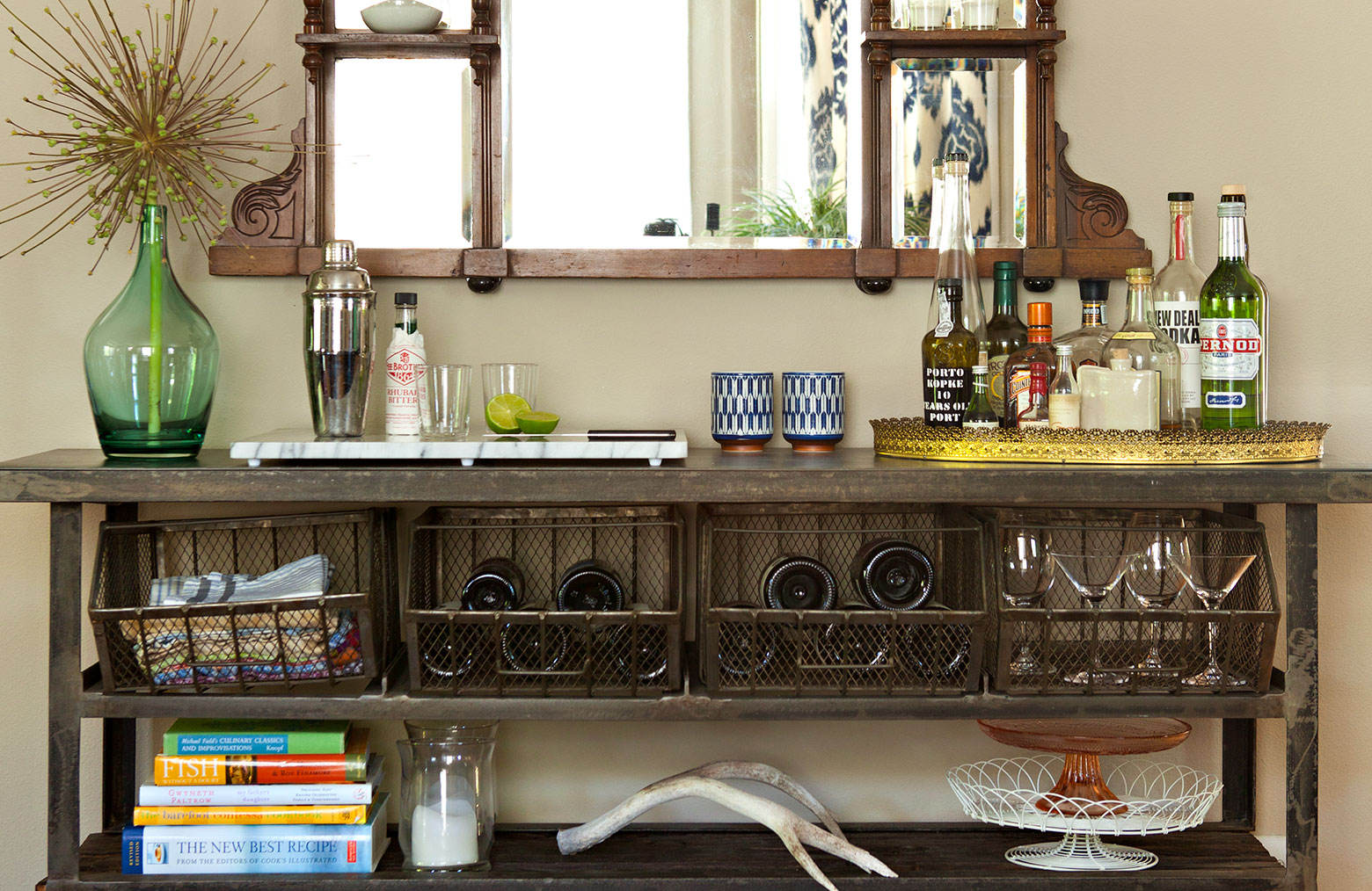 a brown sideboard storing alcohol bottles and glasses