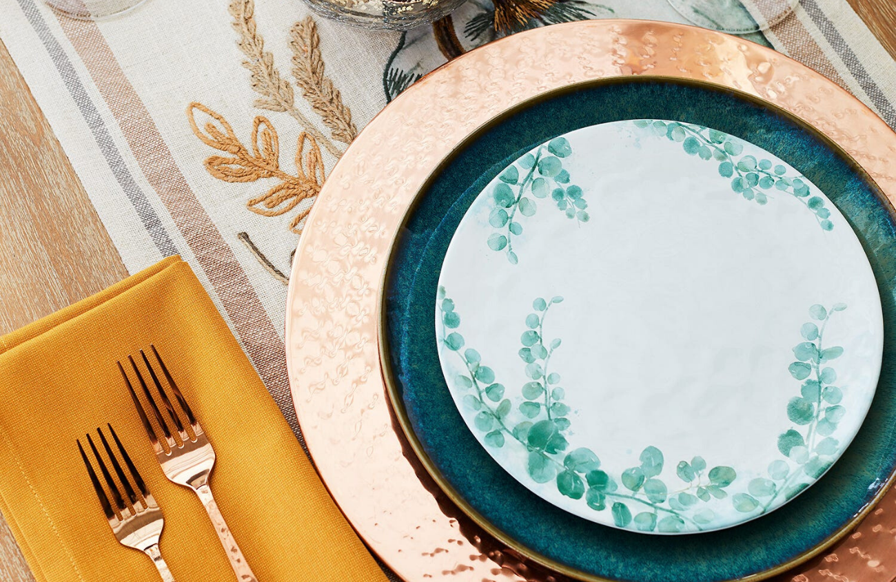 Thanksgiving dinner party spread with gold accents and Pumpkin table runner.