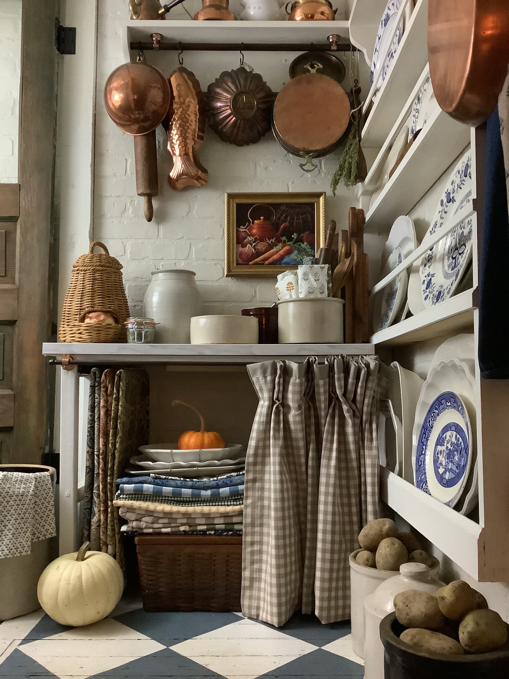 country cottage pantry with vintage baskets and storage