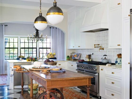 antique wood island and black and white checkered tile floor in remodeled island