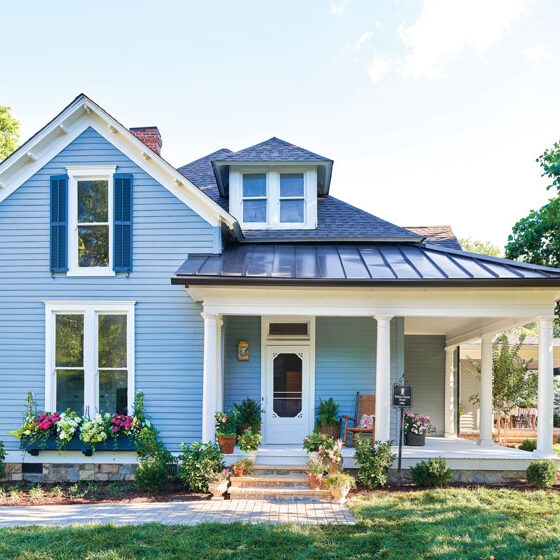 after Project House in Frankline exterior with flowers and blue siding