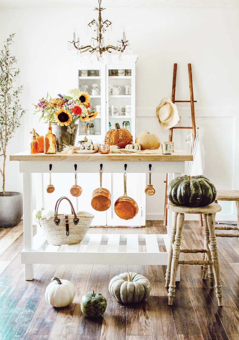 farmers market fall kitchen with pumpkins and sunflower bouquet