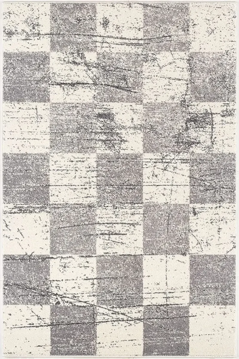 white and gray rug with distressed pattern