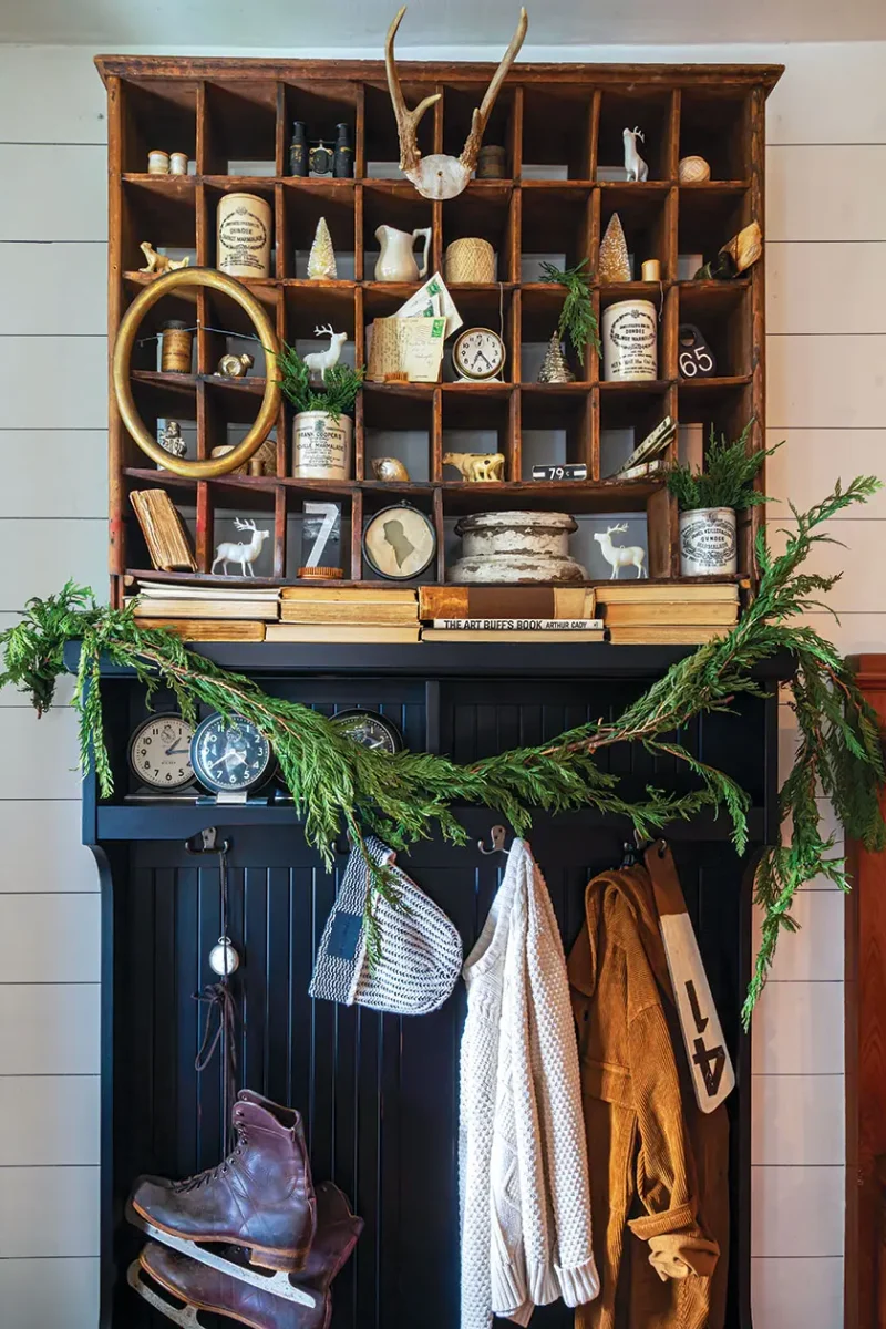 vintage ice skates as holiday decor along with fresh cedar garland