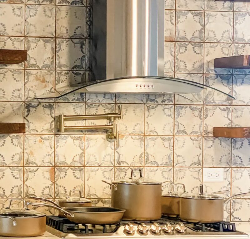 mosaic tile backsplash and built-in faucet in Cottage on Fort kitchen