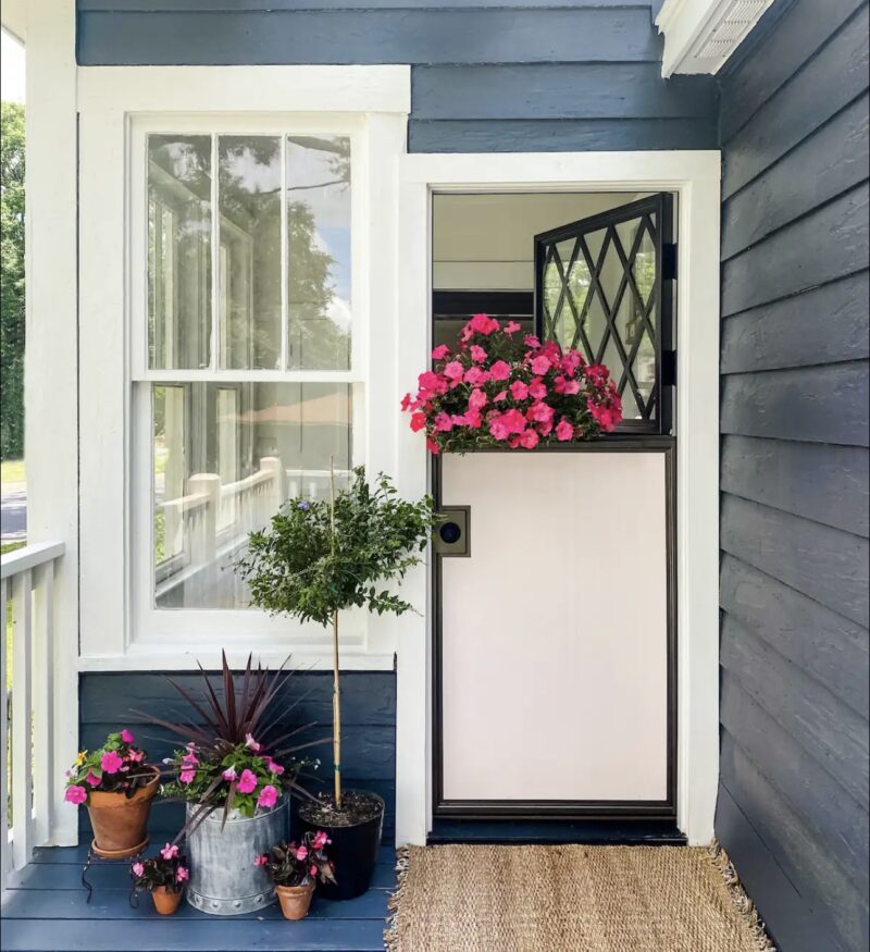 back door with potted flowers at Cottage on Fort vacation stay