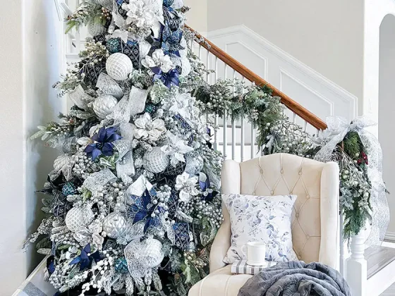 blue and white tree in foyer of Nissa-Lynn's magical holiday home