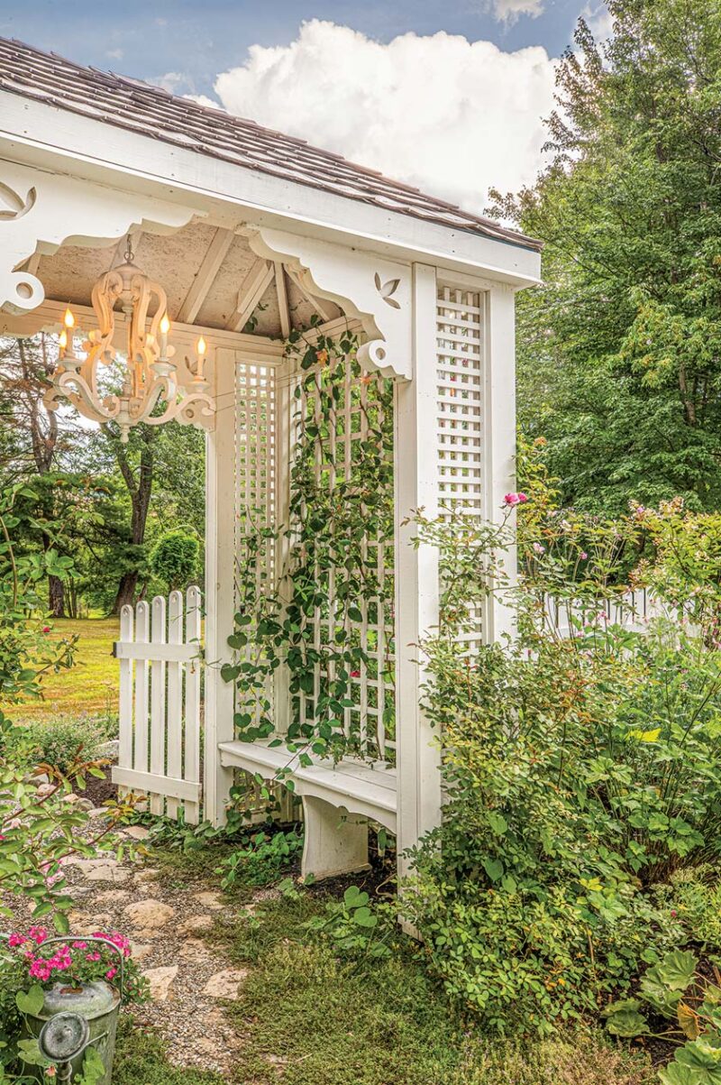 wooden chandelier in garden structure with trellis